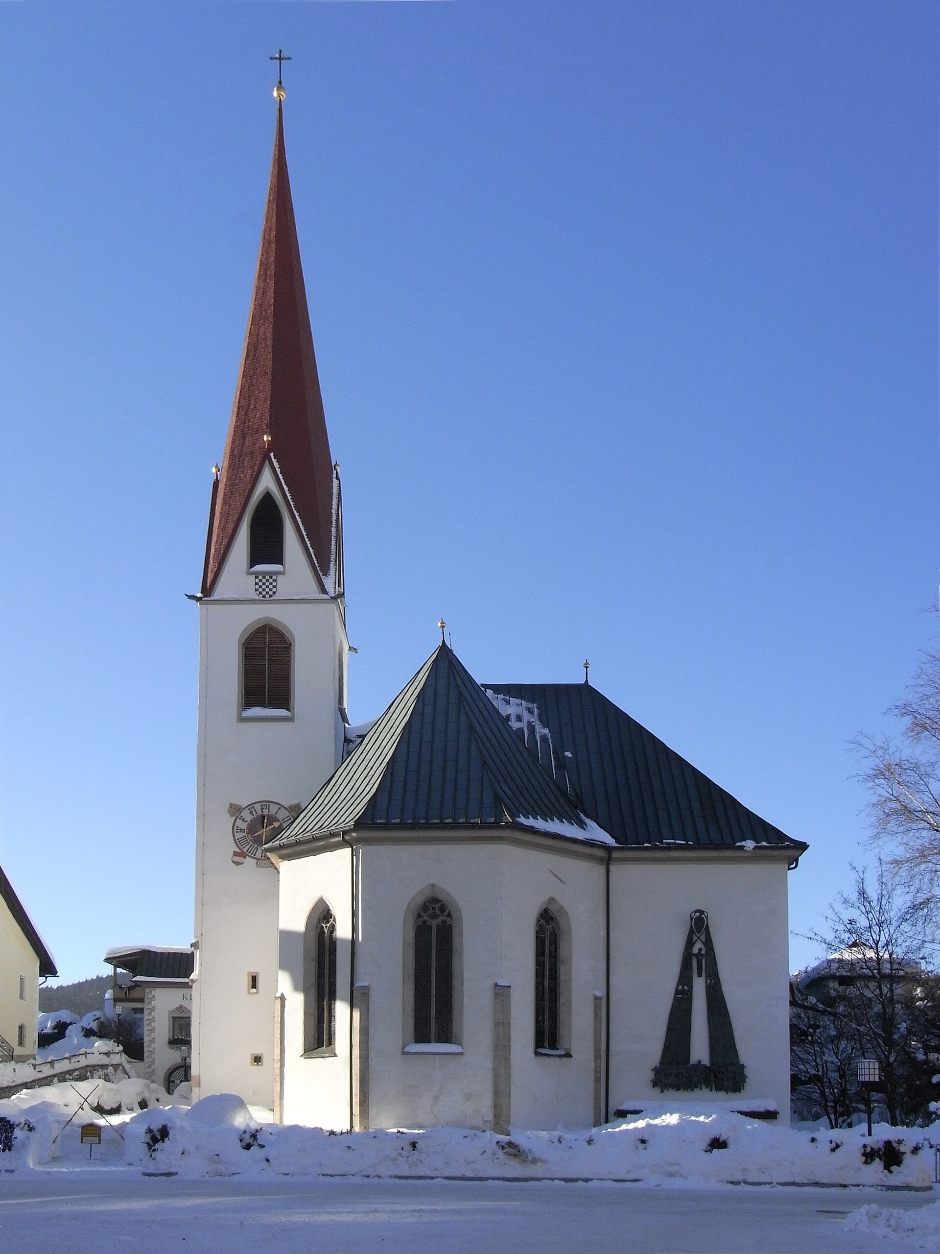 Iglesia parroquial de San Osvaldo de Seefeld en Tirol, vinculada a la tradición eucarística