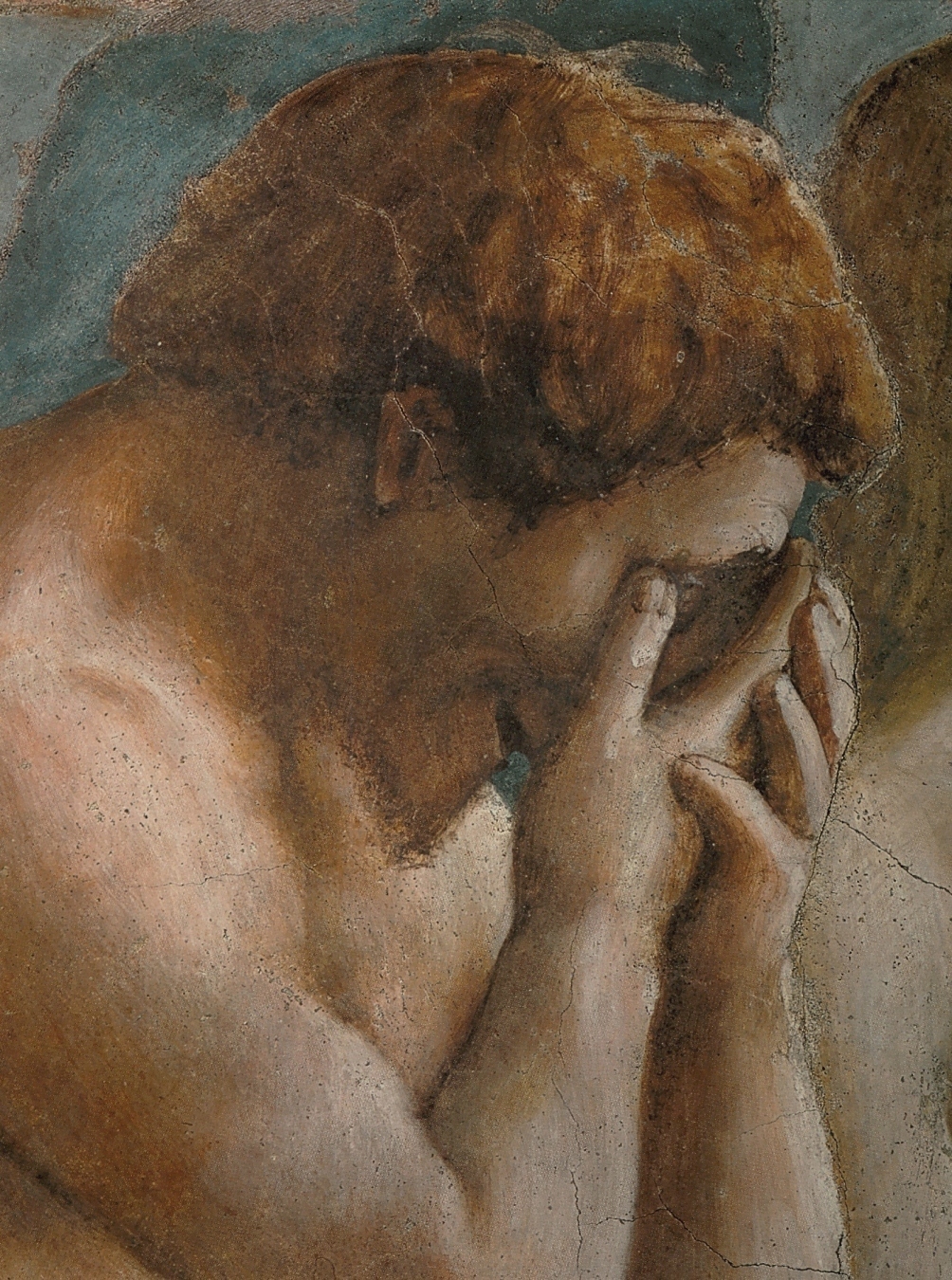 Detalle del fresco de Masaccio: Adán, desnudo de hombros, se tapa la cara con las manos al ser expulsado del Paraíso
